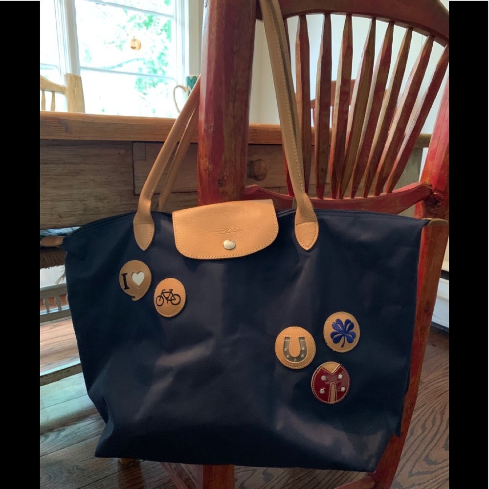 Longchamp Navy Blue Tote with Tan Leather Trim and Decorative Pins